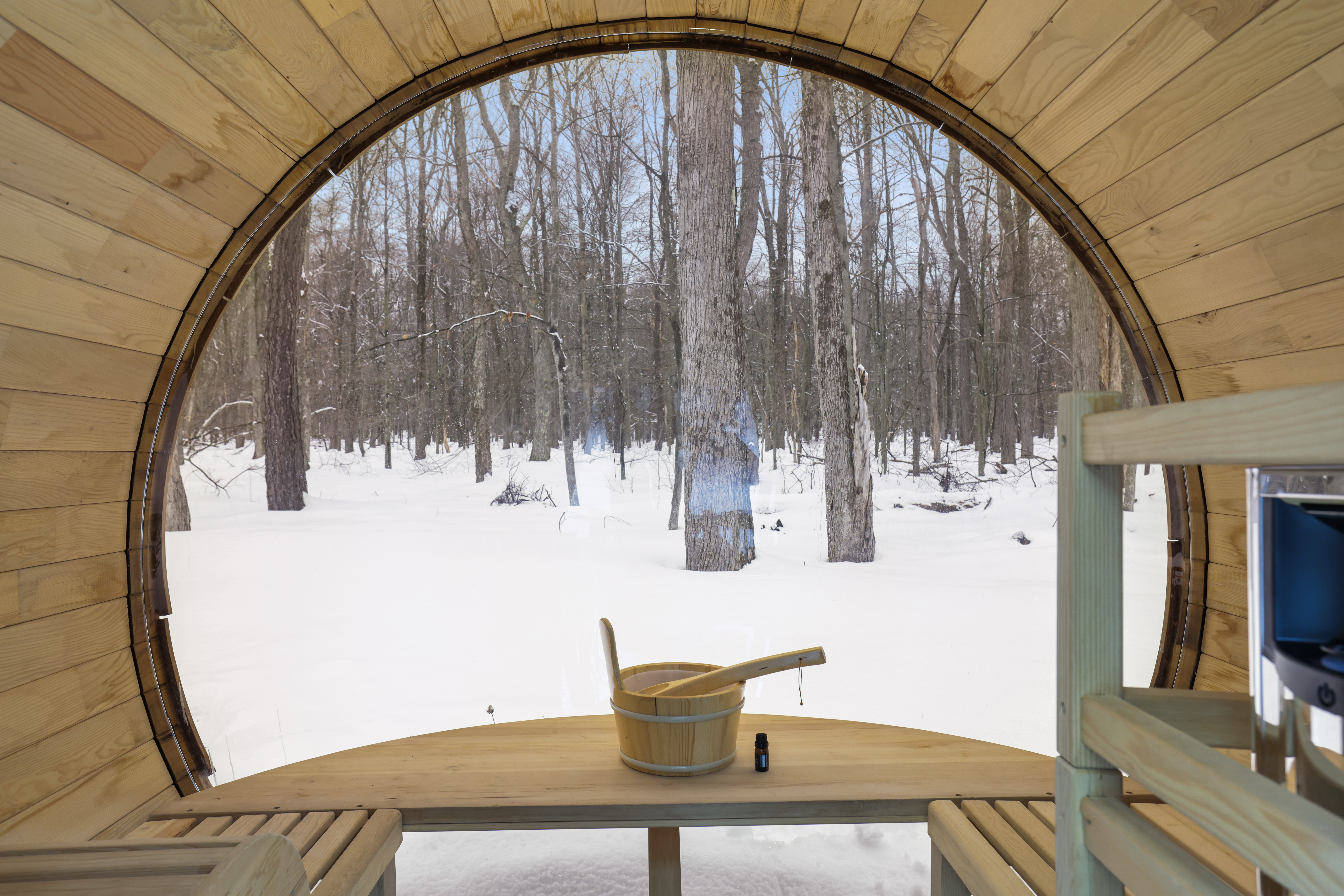 Barrel sauna with forest view